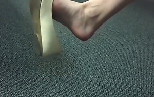 Amazing feet in flats dangling w/ shoe drop