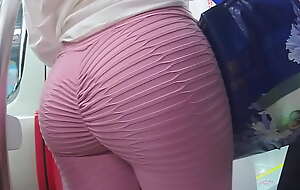 Possibility pulling ass in pink leggings