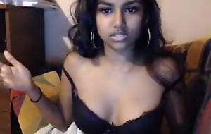 Dark skin teen oils her tits