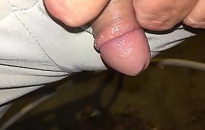 Tiny dick pissing outside