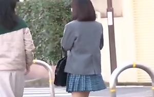 Big-titted teen gets fucked not far from a Japanese bus