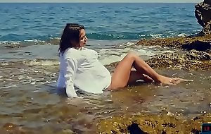 Sexy bikini teen strips naked outdoor near slay rub elbows with sea