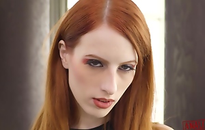 Red haired babe, Alex Harper is engulfing a big, black meat stick like a pro